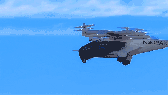 A white and black vertical takeoff aircraft, marked "N302AX," flies against a clear blue sky with multiple propellers visible.