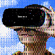 A person wears a VR headset with "Coming Soon!!!" displayed on the screen, extending one hand with a finger pointing upwards, against a blue sky with clouds background, symbolizing the intersection of technology and social media mental health awareness.