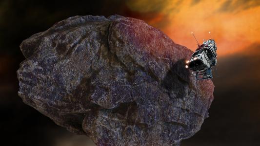 A spacecraft flying near the surface of a large, rocky asteroid in space, with a fiery sky in the background