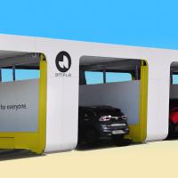Several electric cars enter adjacent charging or battery-swapping stations under a white and yellow structure labeled "ample" with the slogan "Electric cars for everyone.