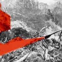 An old black and white photo of a man with a red smoke grenade.