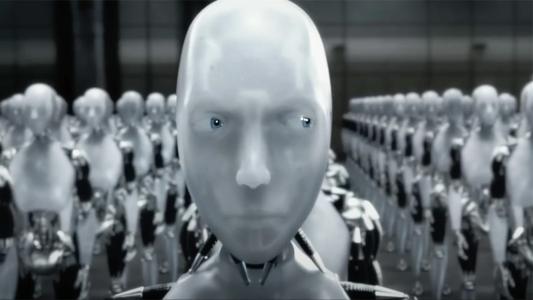 A close-up of a humanoid robot with a neutral expression standing in front of rows of identical robots in a futuristic setting.