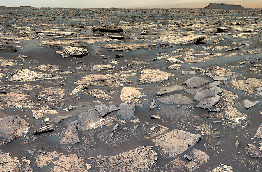 An image of Mars&rsquo; Gale Crater taken by the Curiosity rover. It is rocky and desolate. 
