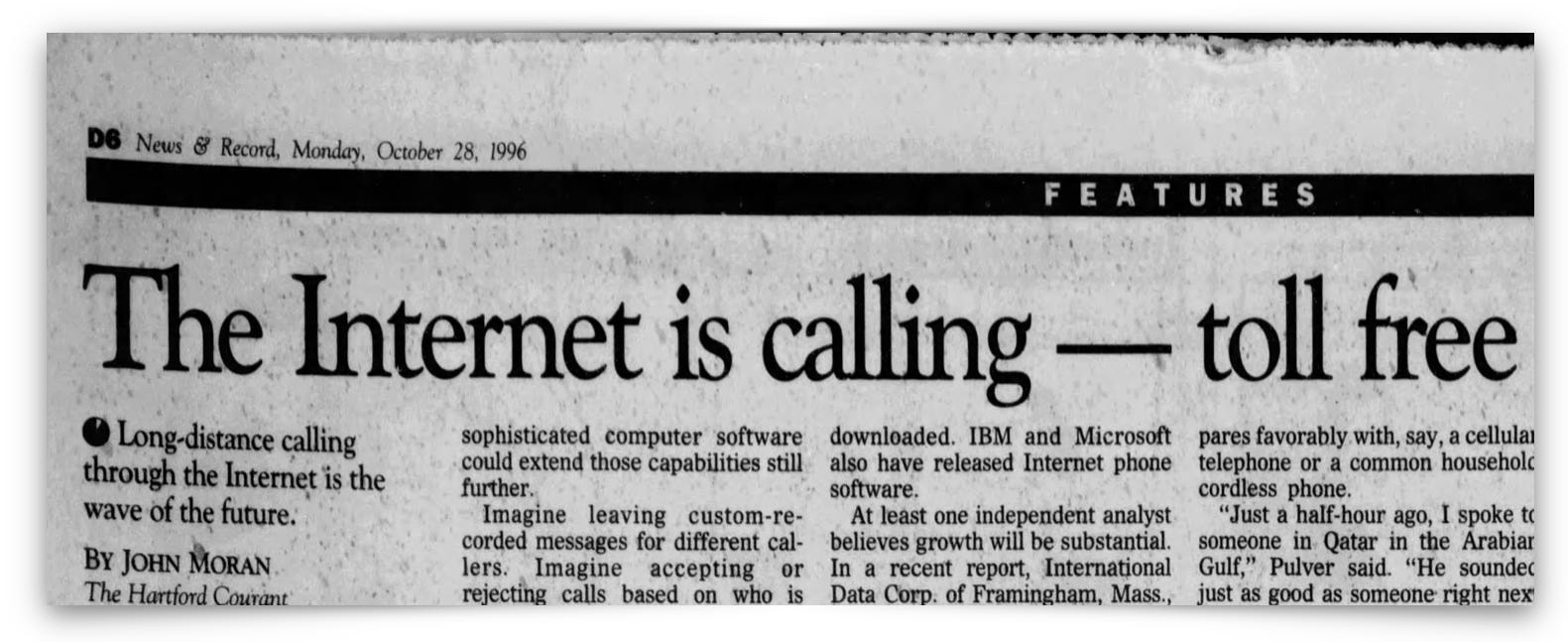 A newspaper article headline reads, "The Internet is calling &mdash; toll free," discussing free long-distance calling via the Internet, dated October 28, 1996.