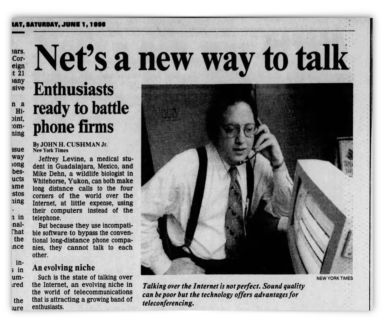 A man in a suit speaks on the phone while looking at a laptop, featured in a newspaper article about using the Internet for long-distance communication, dated June 1, 1996.